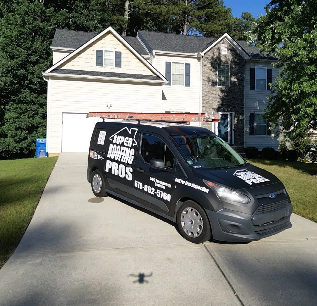 Super Roofing Pros van in the driveway of a two-story home with a new roof